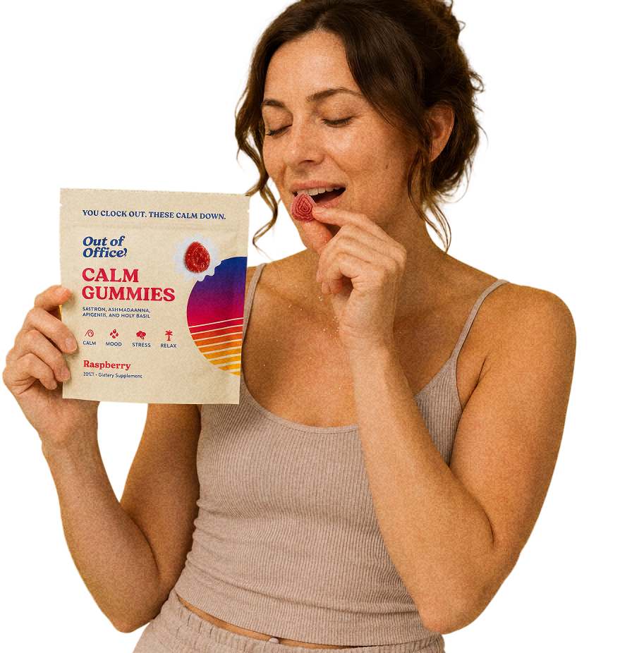 Woman eating an Out of Office Calm gummy and holding the pack